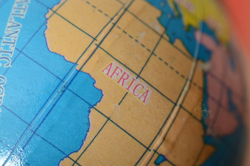 The Africa map on a globe becomes a gateway to discovery, enticing travel enthusiasts